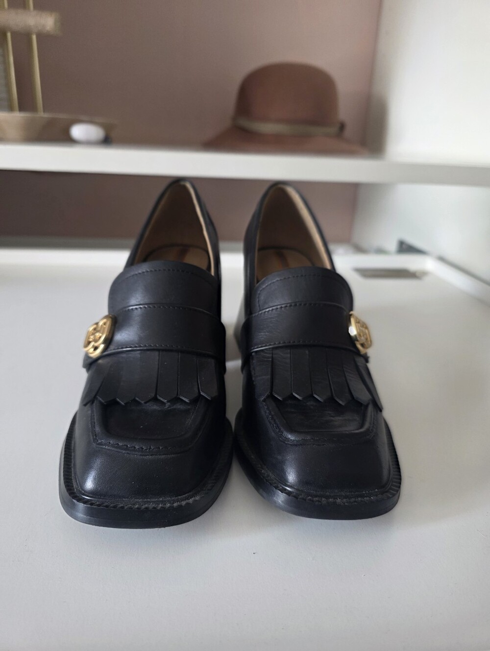 Classic Black Leather Fringe Loafers with Gold Accent